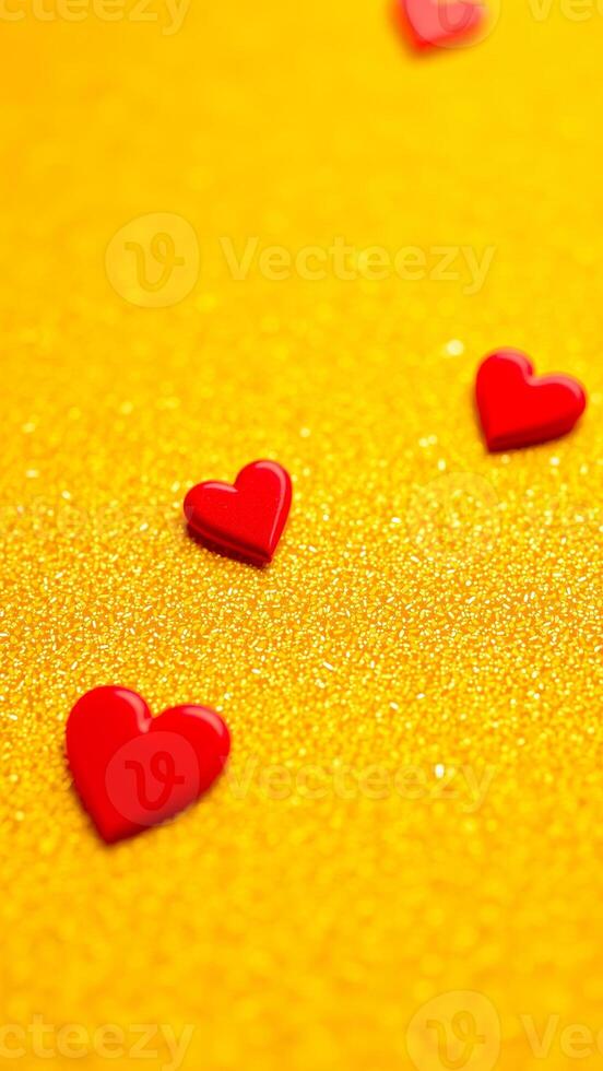 red hearts on a sparkling gold background photo