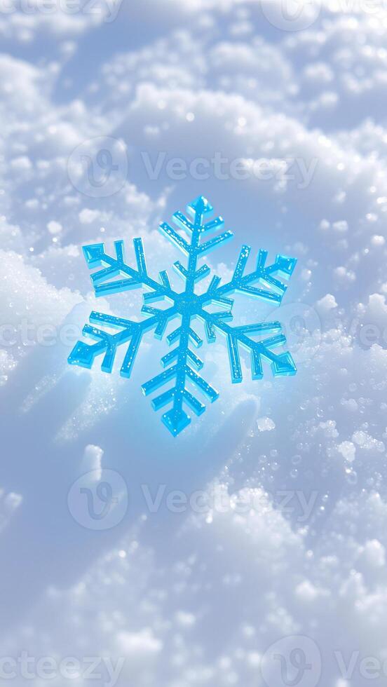 blue sparkly snowflake rests on white snow photo