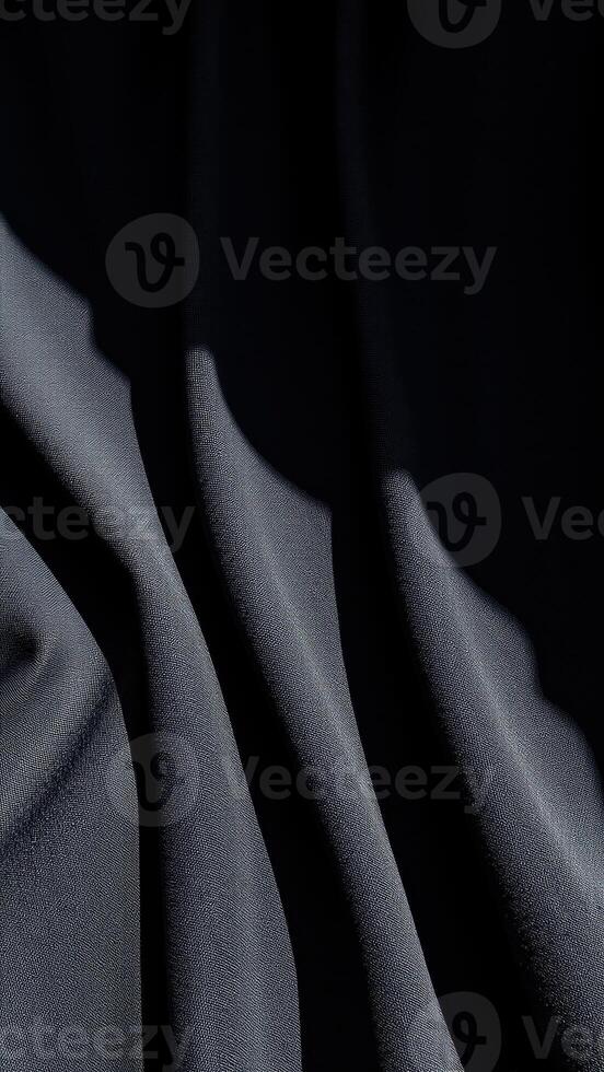 draped black fabric with textured surface photo