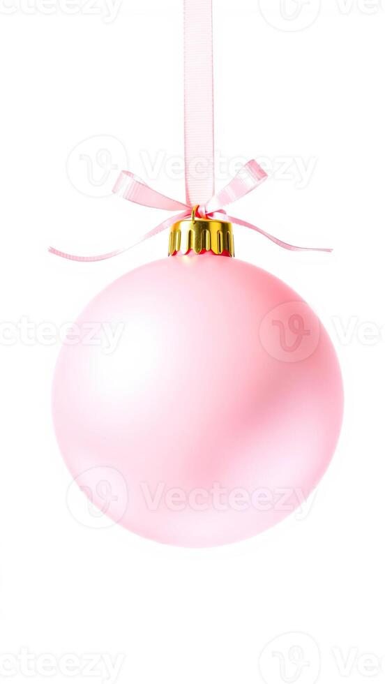 pink bauble with a golden top hangs from a delicate ribbon bow photo