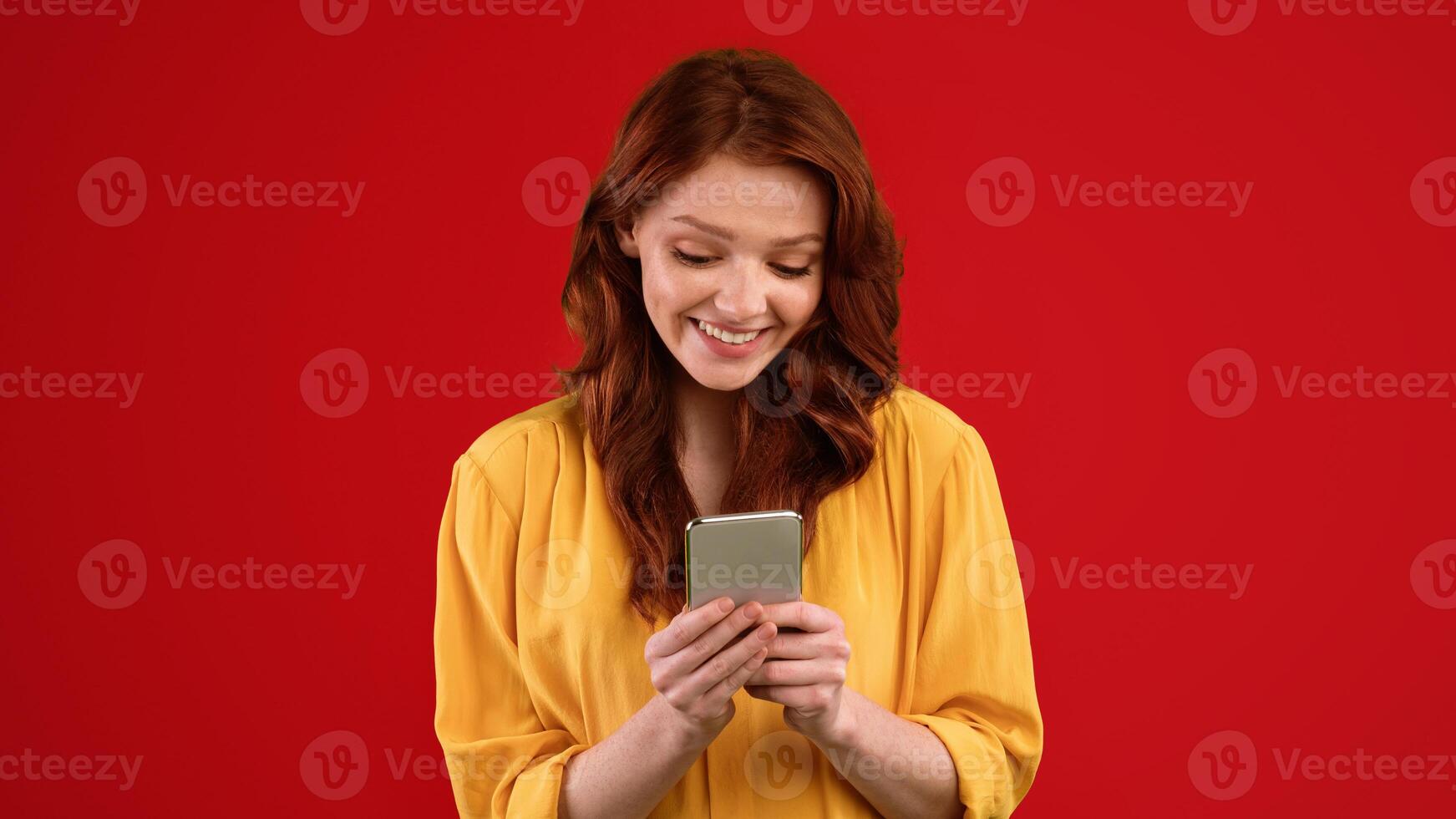 Social Media App. Girl Using Smartphone Texting With Friends Online Standing In Studio On Green Background. Panorama photo