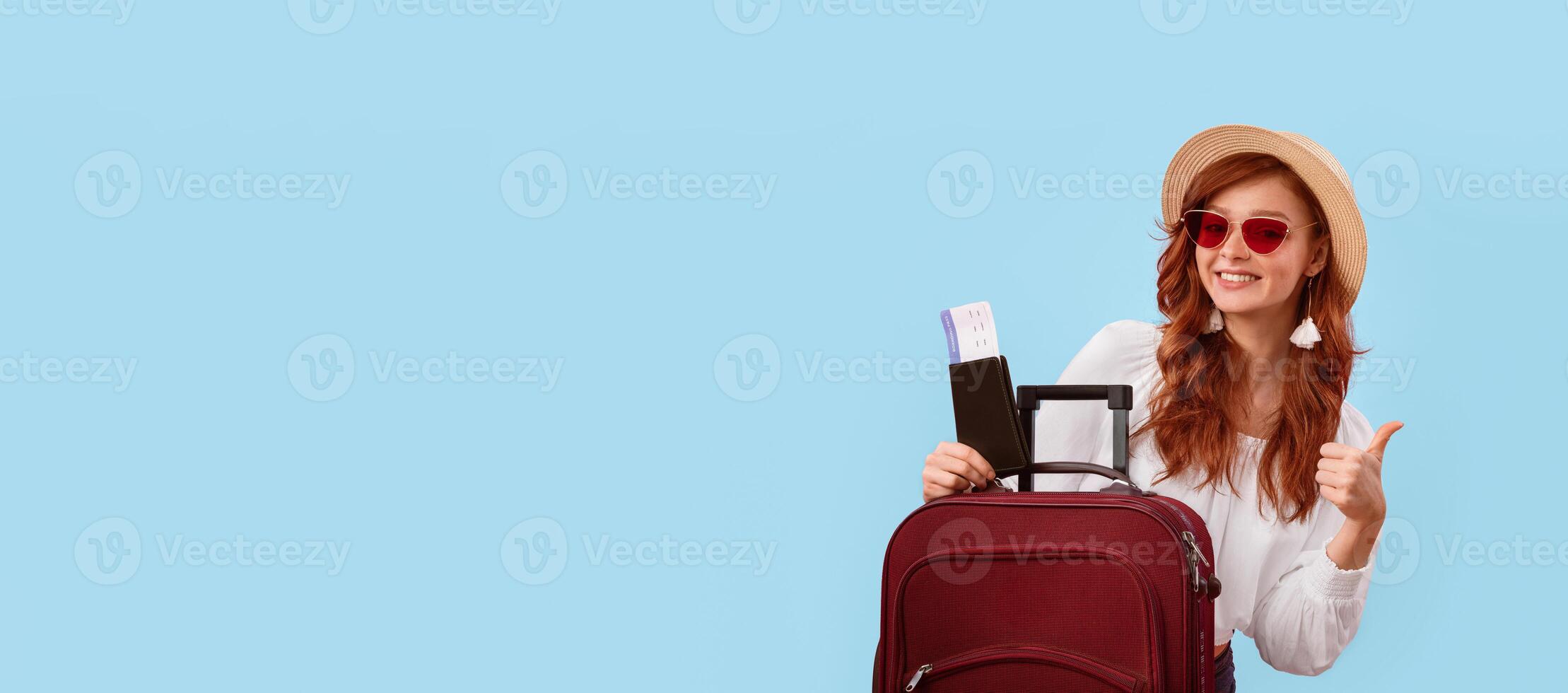 Summer Travel. Happy Traveler Girl Posing With Tickets, Passport And Suitcase Gesturing Thumbs-Up On Pink Studio Background. Copy Space, Panorama photo