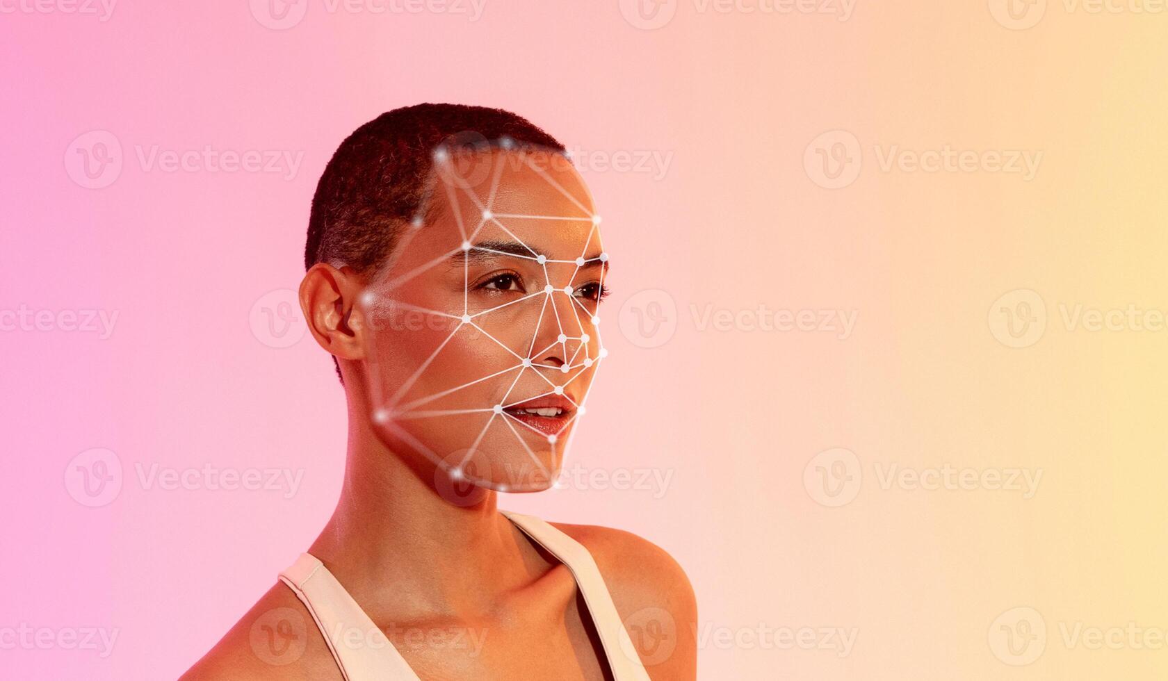African American woman stands confidently against a gradient background, showcasing a facial recognition grid overlay on her face. photo