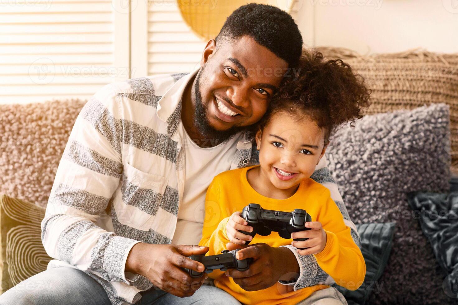 African american family gamers playing on console during quarantine photo