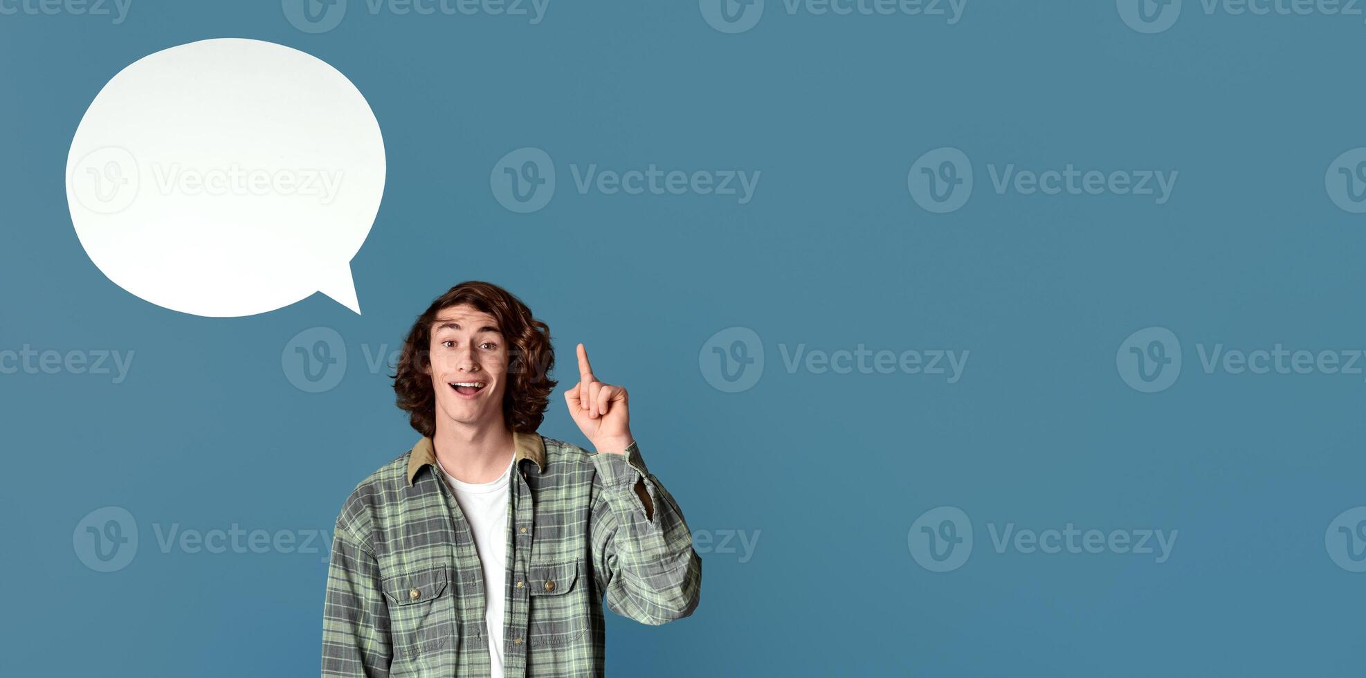 Funky young guy with speech bubble having creative idea on turquoise background, empty space for design photo