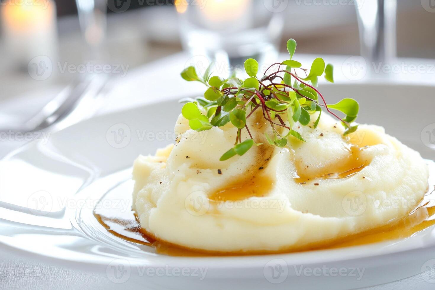 Elegant presentation of creamy mashed potatoes in a fine dining restaurant, garnished and beautifully plated photo