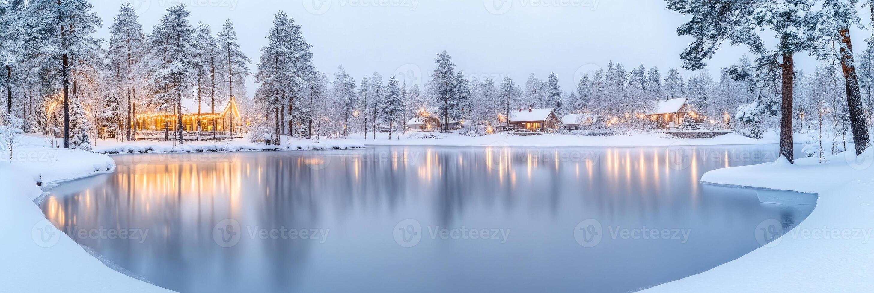 A serene winter morning at a frozen lake surrounded by snow-covered trees and cozy cabins in a tranquil landscape photo