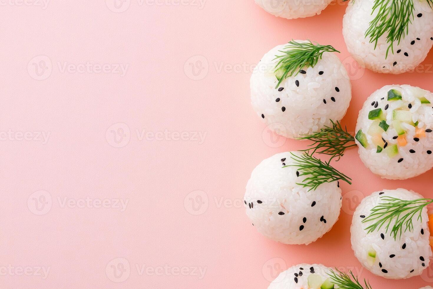 Delicate temari rice balls adorned with seaweed and vegetables on a soft pastel background photo