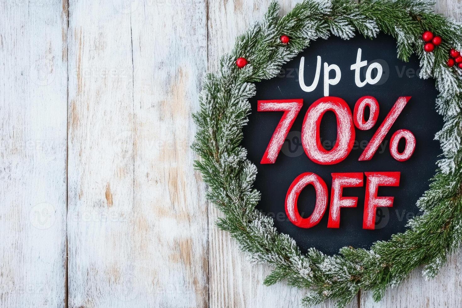 Rustic chalkboard style holiday discount sign offering up to 70 percent off with laurel wreath design photo