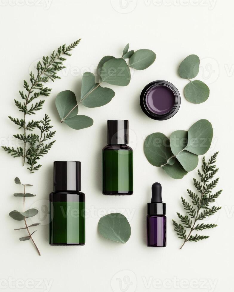 Natural skincare products arranged artfully with eucalyptus leaves in muted green and purple hues photo