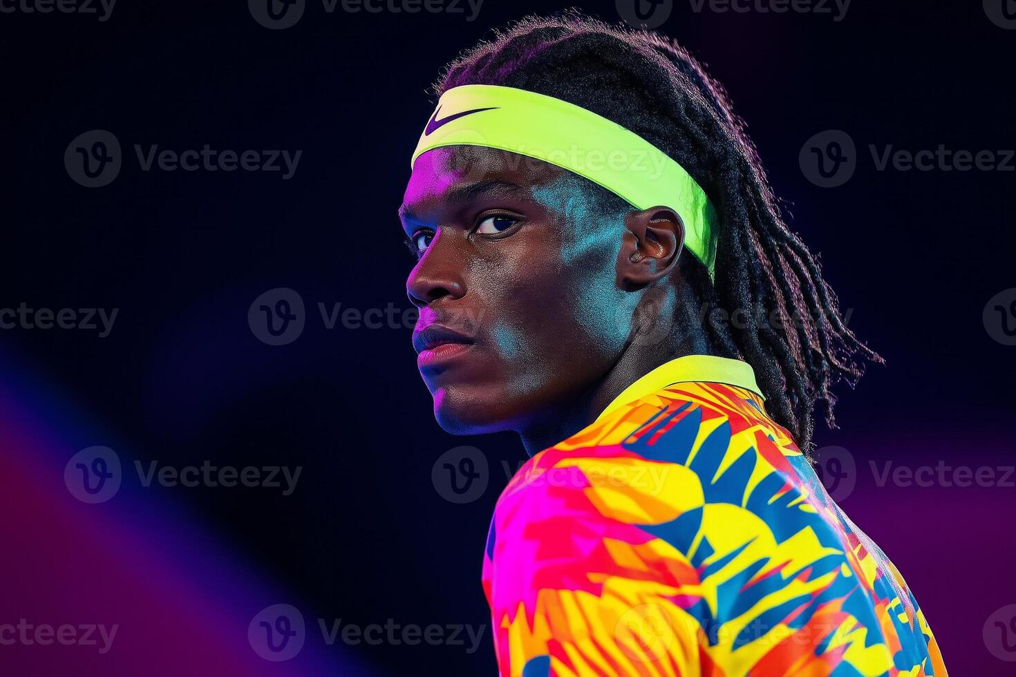 Dynamic tennis player in abstract colorful uniform ready to serve against energetic backdrop photo