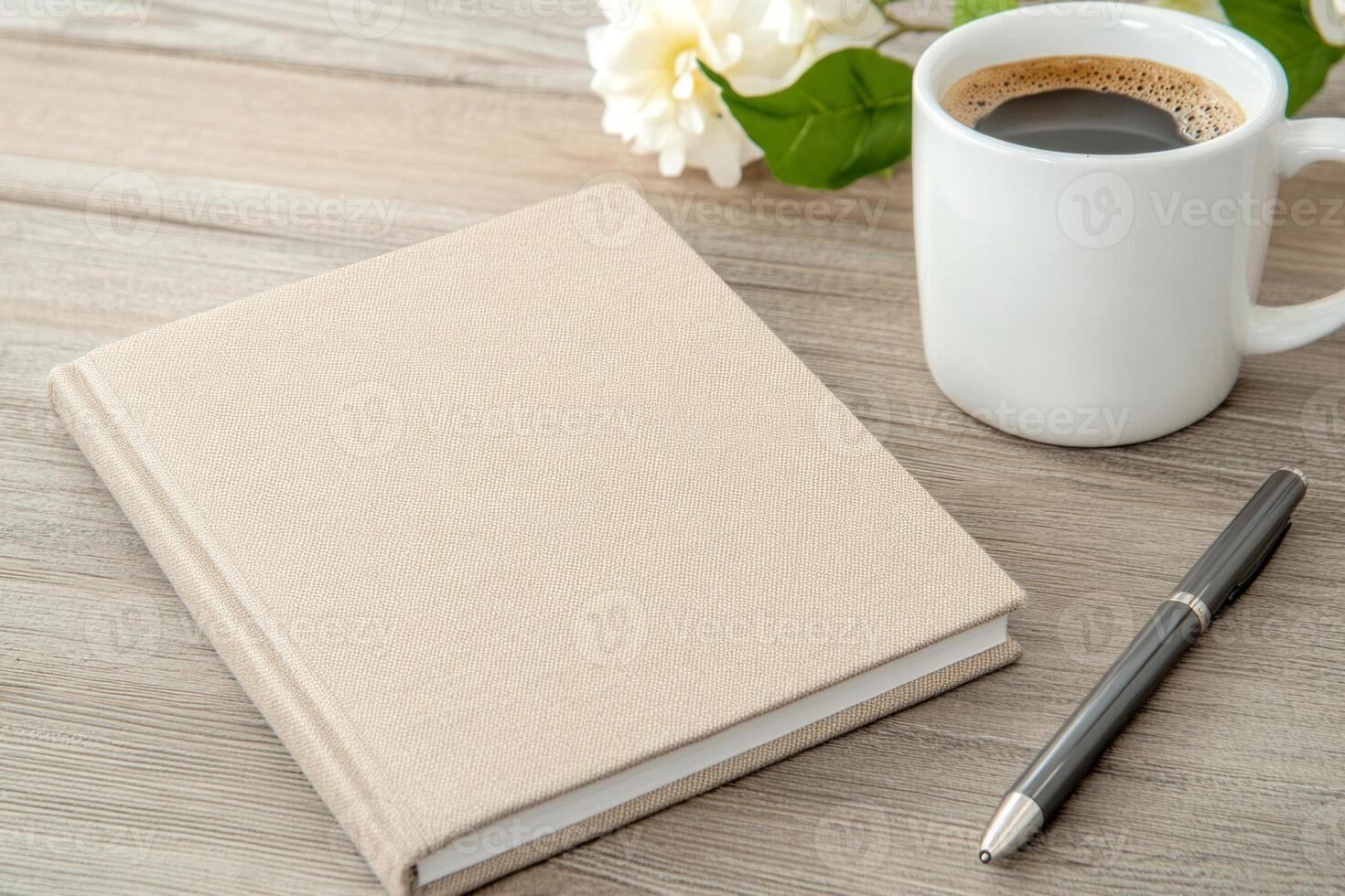Stylish workspace featuring eco-stationery and coffee mug on a wooden desk in a serene, minimal environment photo