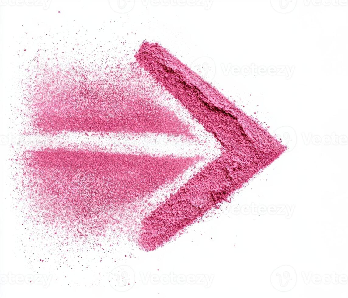 Pink arrow made from powder highlights direction and movement on a bright background for creative projects photo