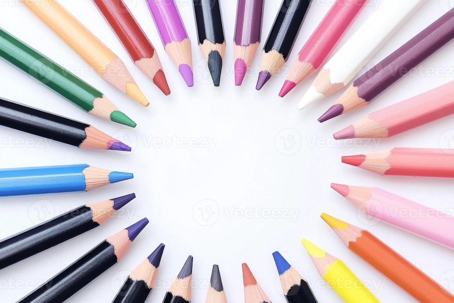 A vibrant circular arrangement of colored pencils showcasing rainbow hues on a minimalist background photo