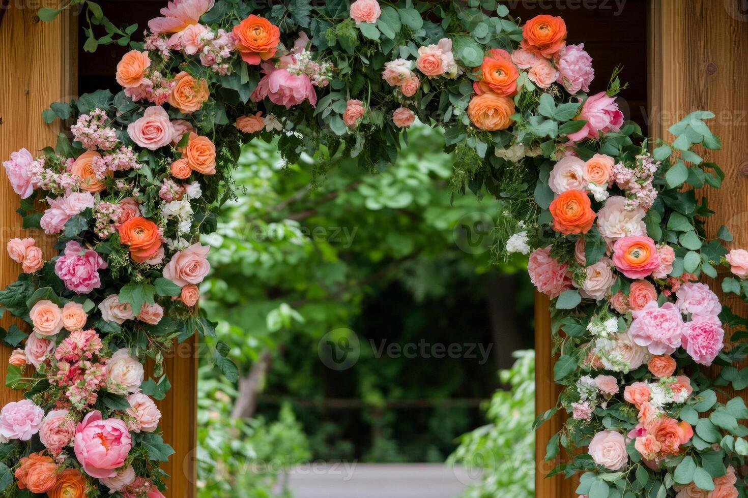 Vibrant boho garden setting featuring a floral arch with terracotta and teal hues surrounded by lush greenery photo