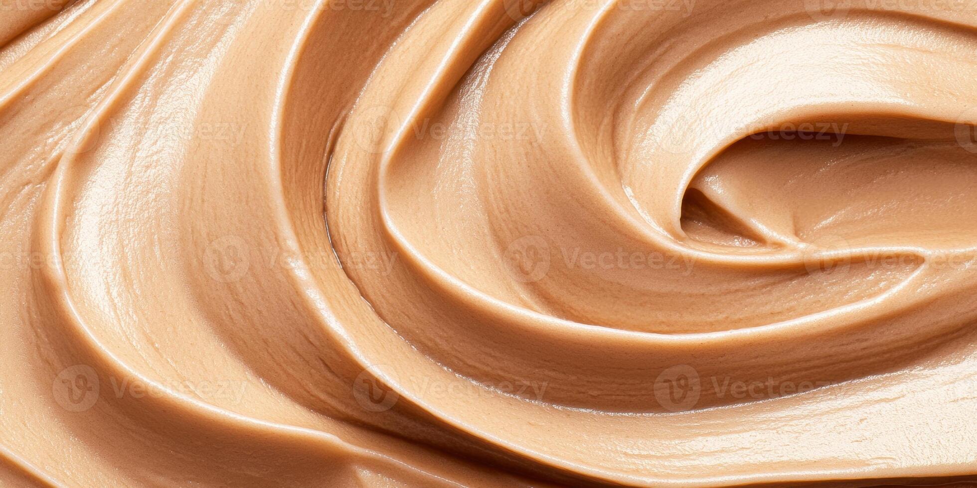 Rich and smooth close-up of warm caramel flowing with a luxurious texture and deep brown tones under soft lighting photo