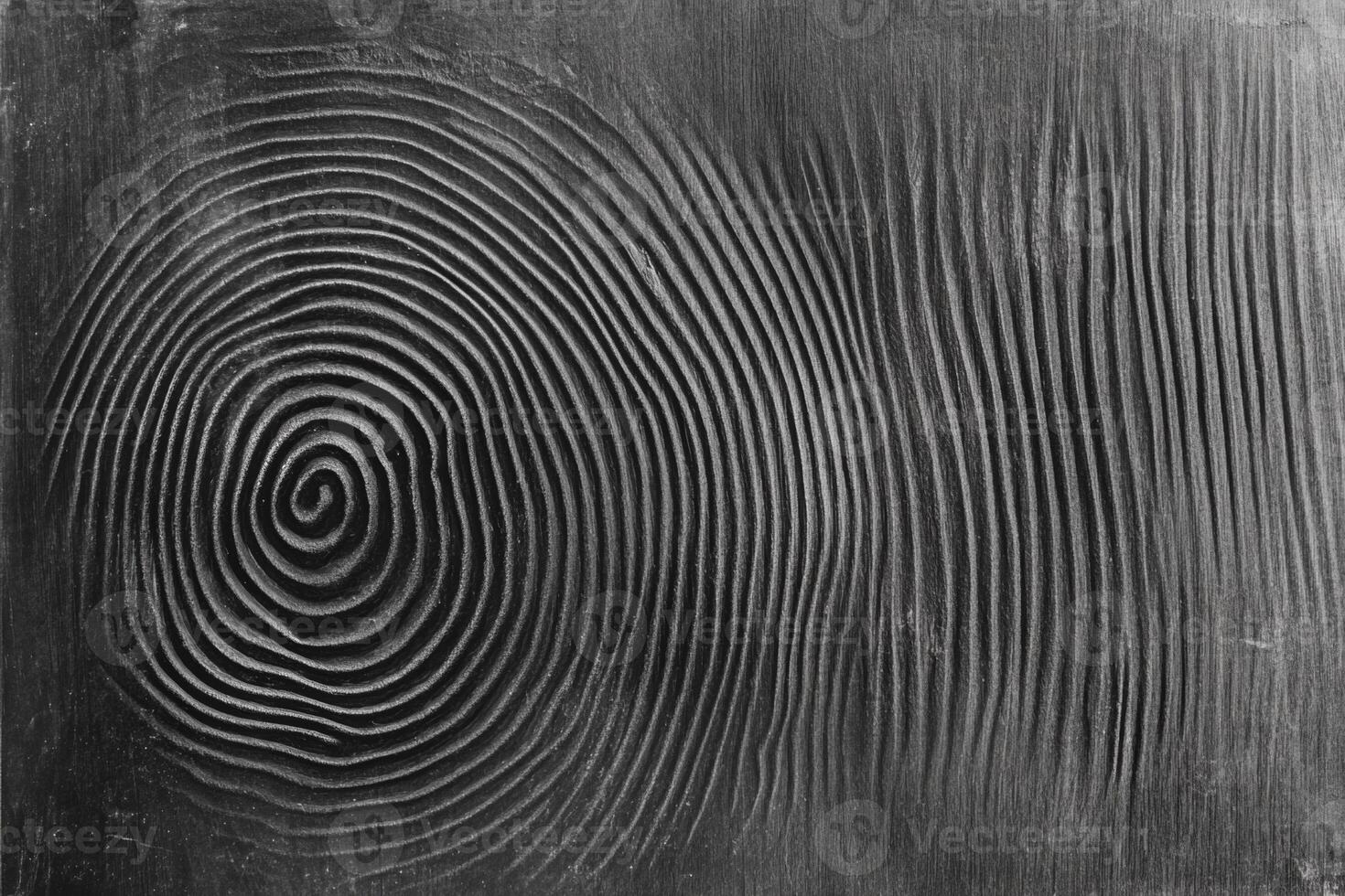High detail zoomed-in view of a fingerprint on a dark surface highlighting forensic evidence photo