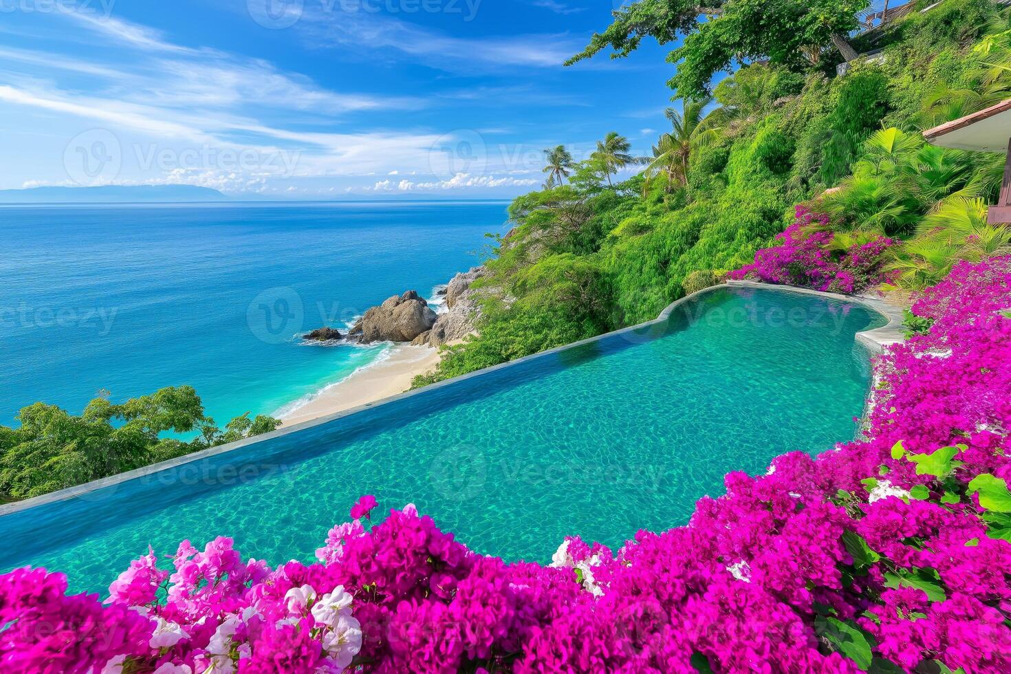 Stunning infinity pool at a tropical resort overlooking ocean and sandy beach with vibrant flowers photo