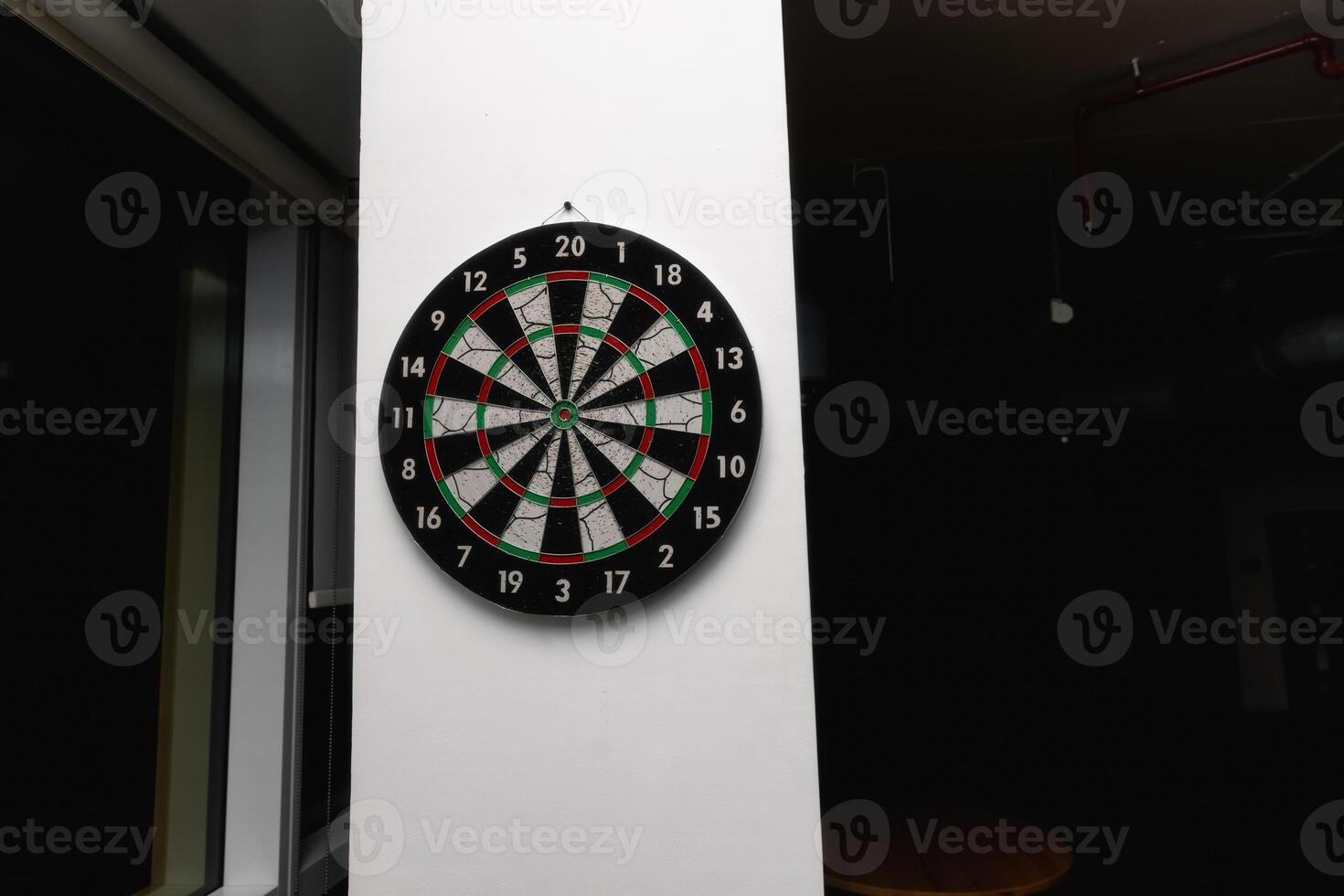 Darts on the wall in the office. Free time for employees. Game break photo