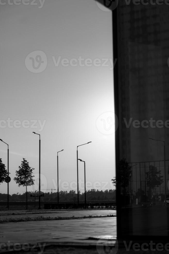 young attractive dancer in casual cloth doing ballet jump on the urban background. Contemporary dance, modern choreography. photo