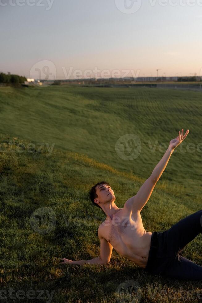 Summer activity and energy. Ballet dancer. Handsome man workout and stretching. photo