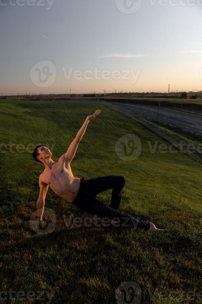 Summer activity and energy. Ballet dancer. Handsome man workout and stretching. photo
