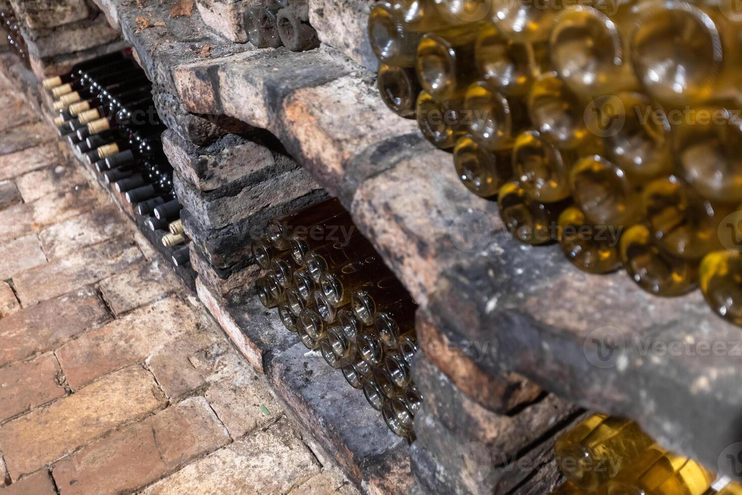 Close up of archive bottle of wines in a wine cellar photo
