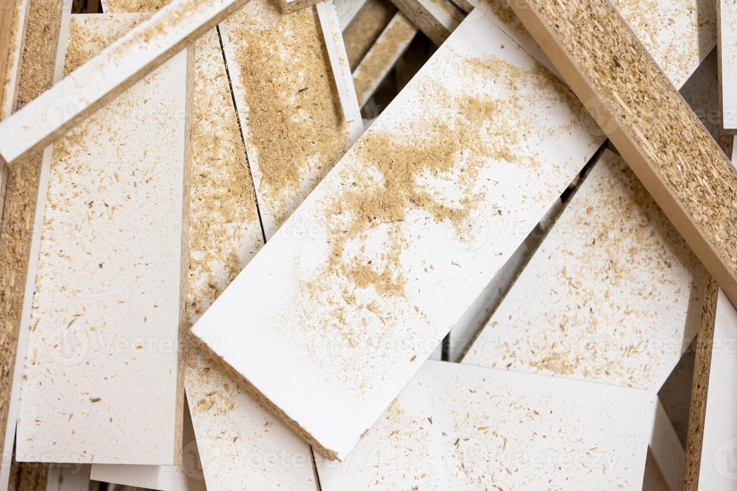 Close up of scraps MDF wood in the bin, woodwork concept photo