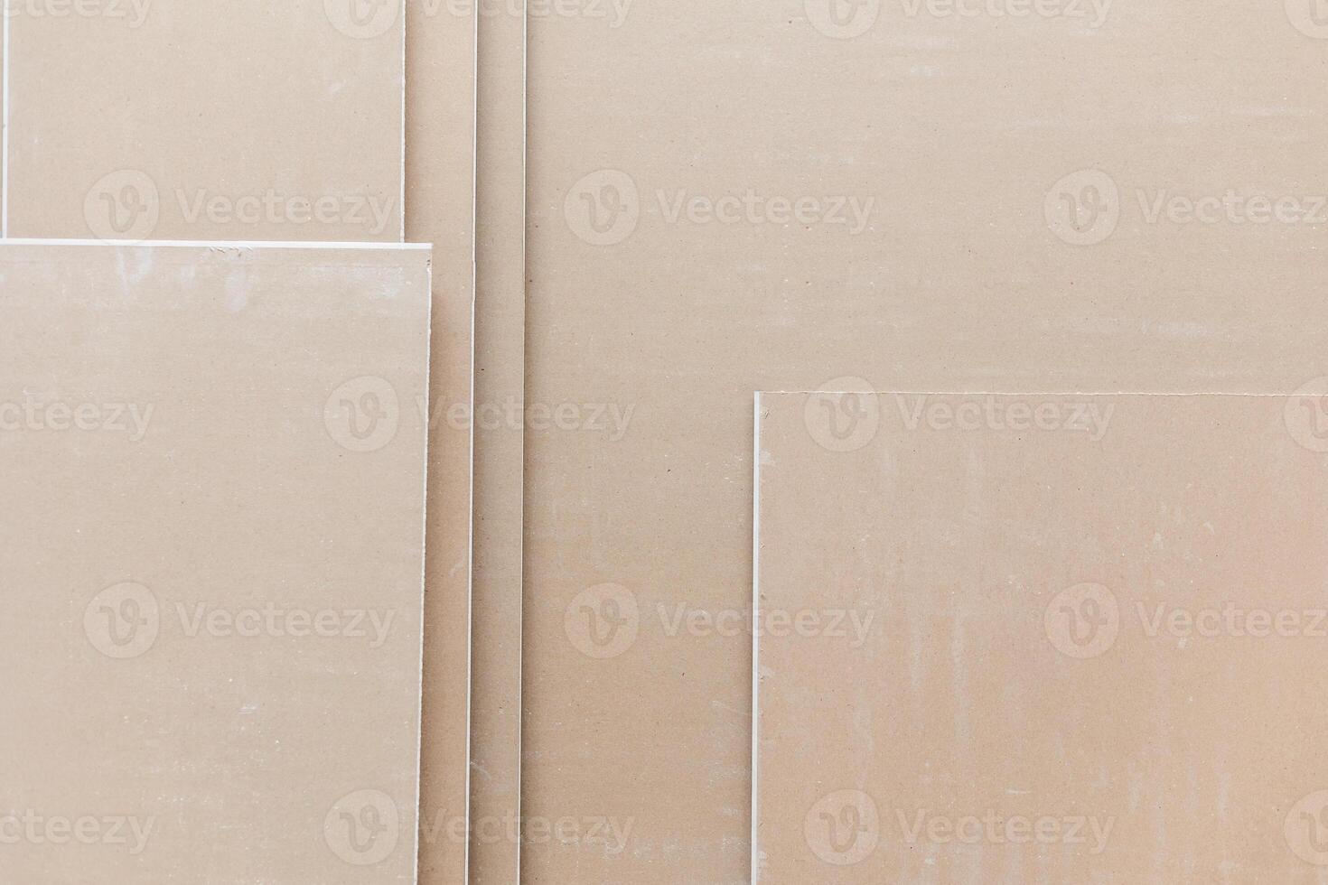 Close up of plasterboard, a type of drywall made of plaster between two sheets of heavy paper, building concept photo