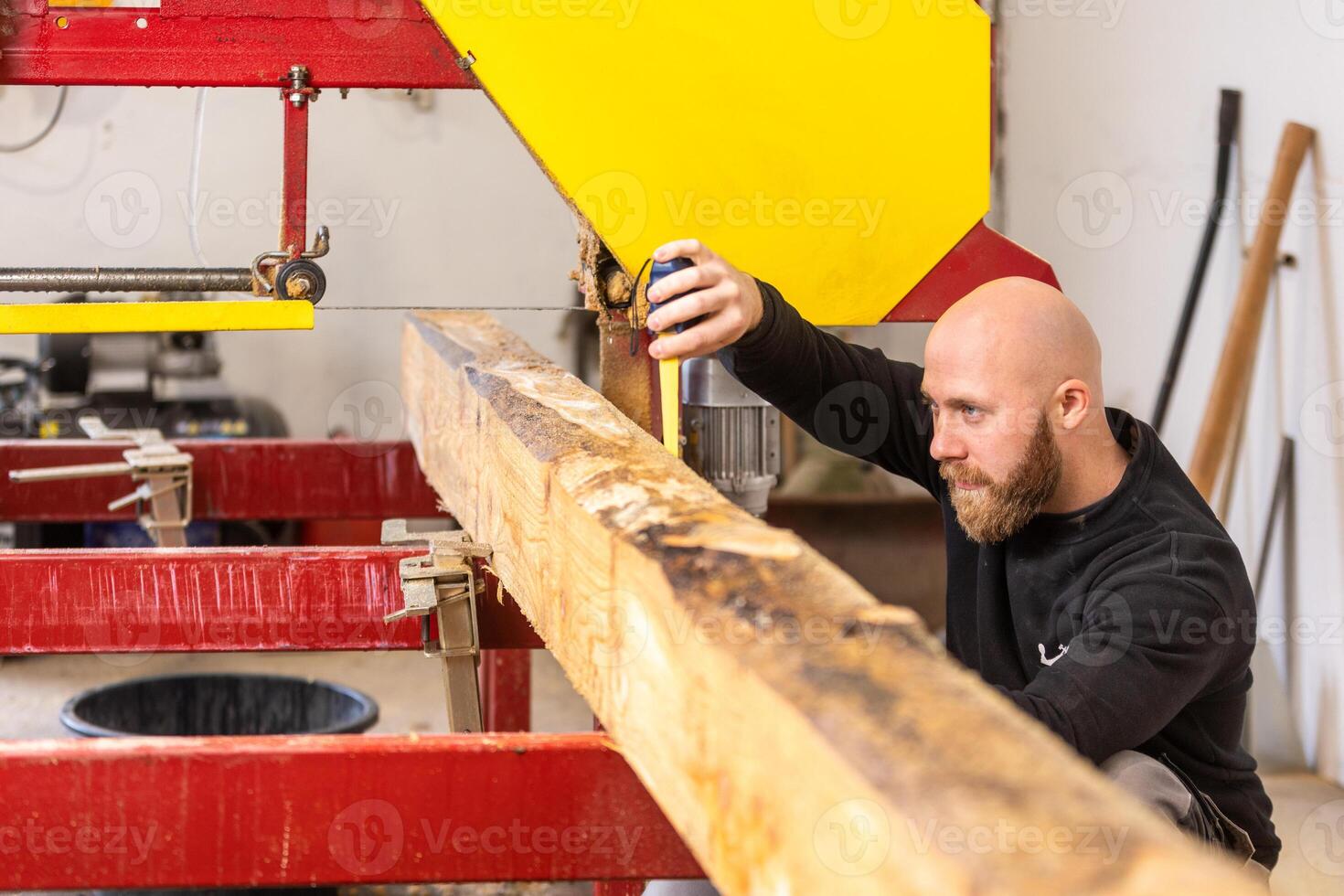 Professional carpenter cutting huge wood to small pieces, joinery concept photo