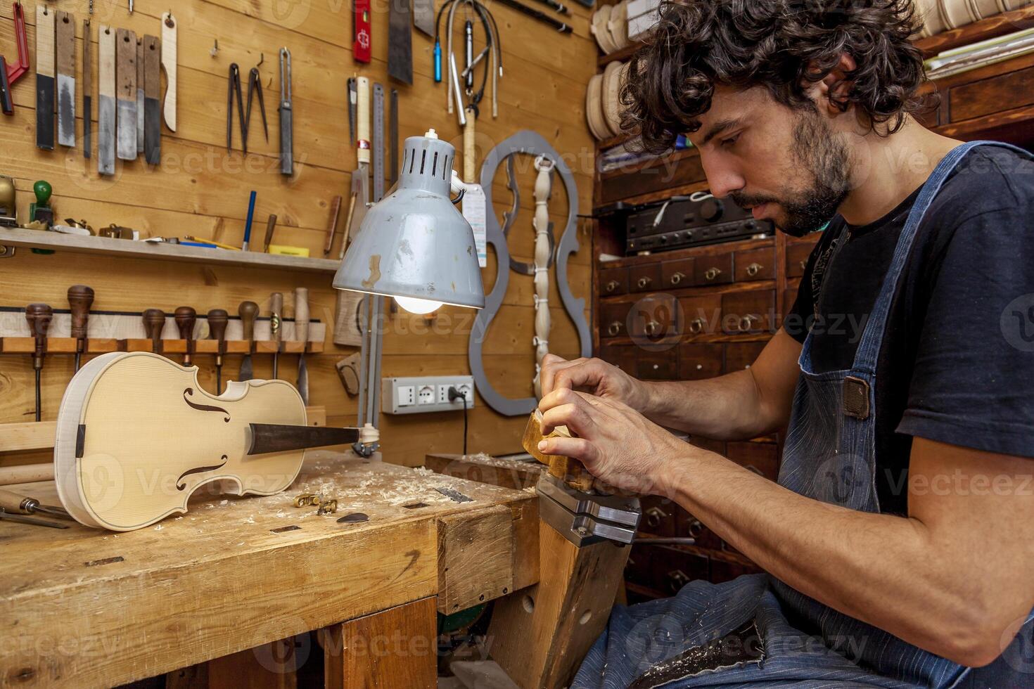 craftsman violinmaker began working on a new violin photo