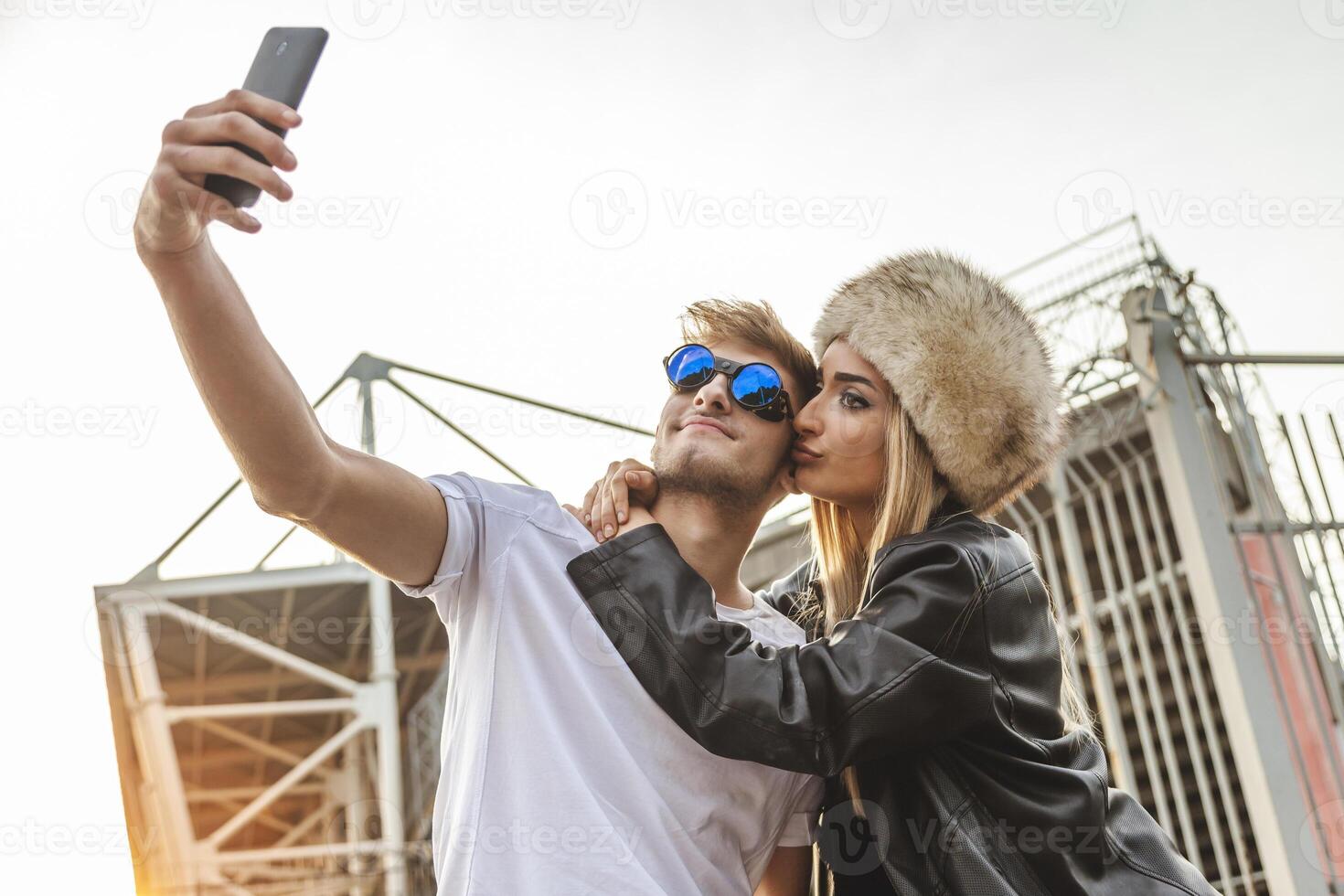 couple of young beautiful lovers take a selfie on the large square photo