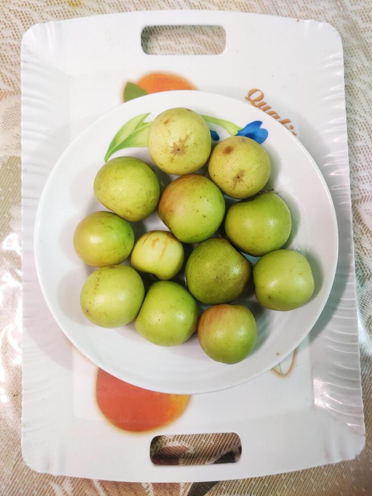 Natural green plum photo