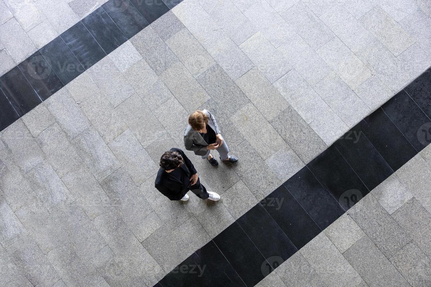 Top view of team of diversity business people are discussing over new strategic strategy project on investment real estate while walking around the office building for new project and planning photo