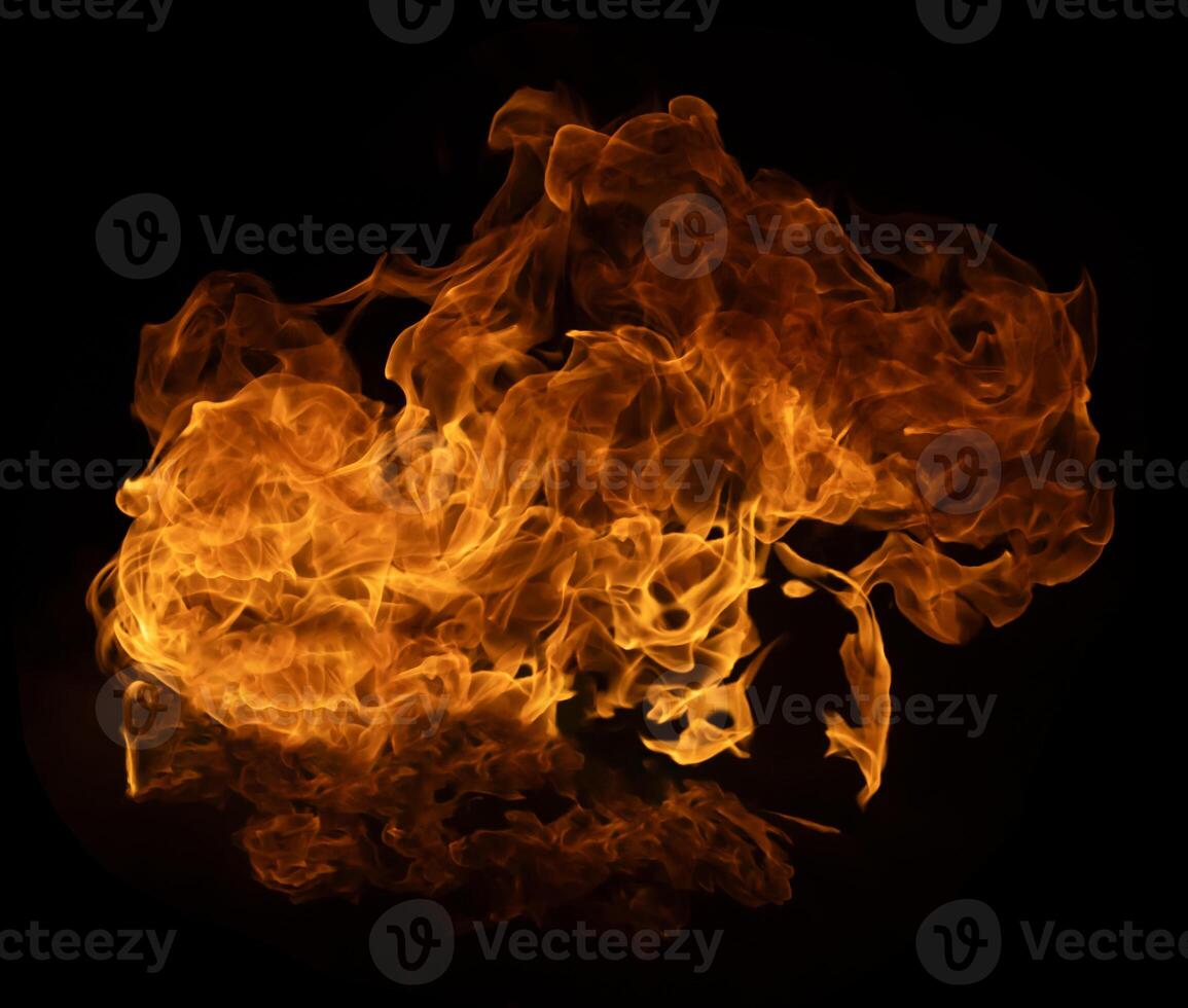 Flame of burning fire of explosive fireball isolated on dark background for abstract graphic design photo