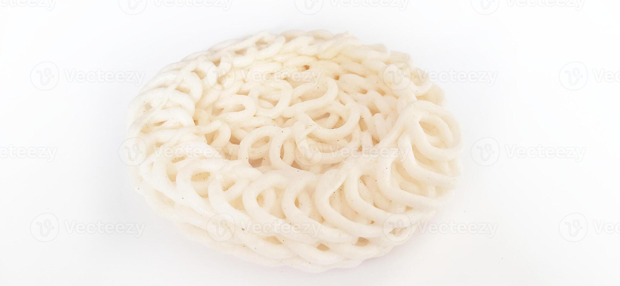 White noodle crackers or kerupuk putih or kerupuk warung made from tapioca flour, snack food from Indonesia isolated on white background photo