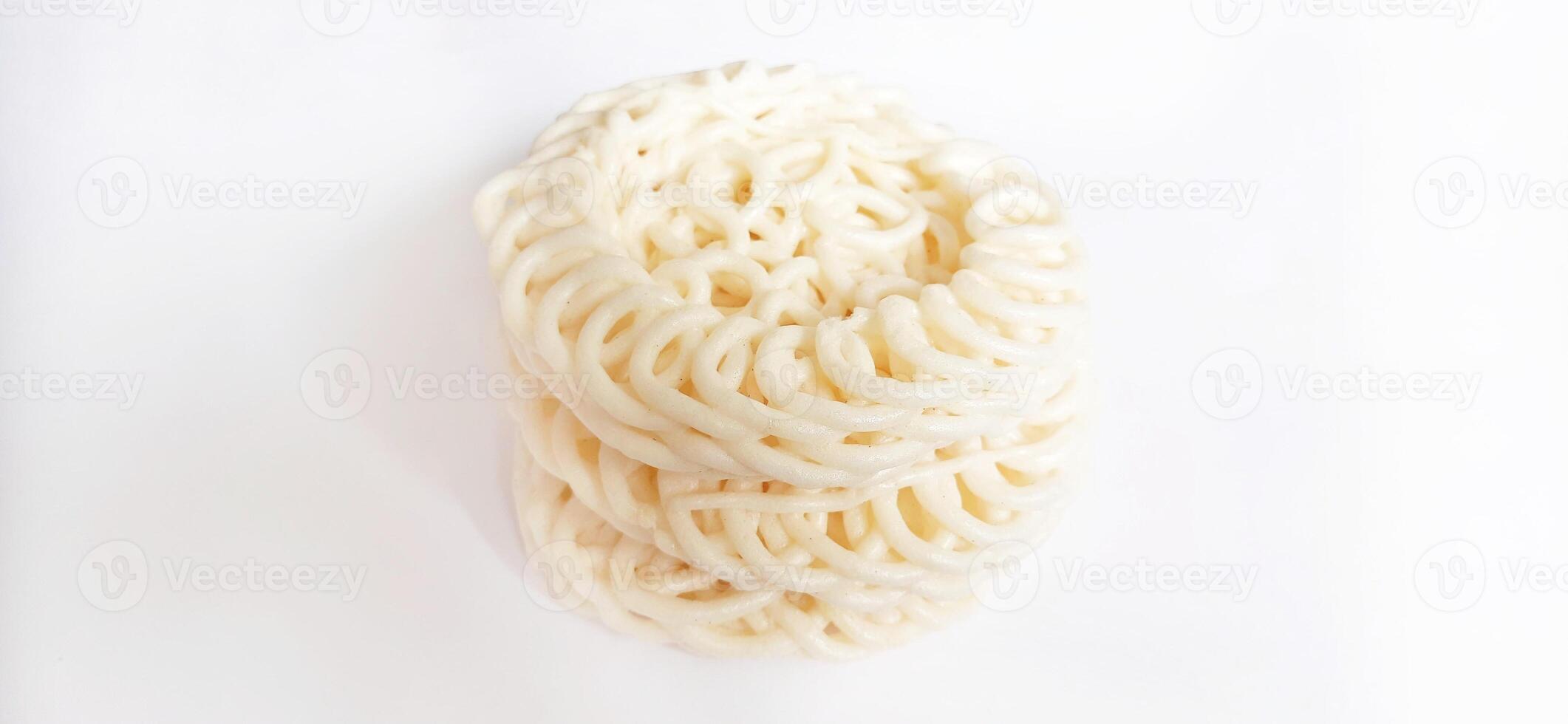 White noodle crackers or kerupuk putih or kerupuk warung made from tapioca flour, snack food from Indonesia isolated on white background photo