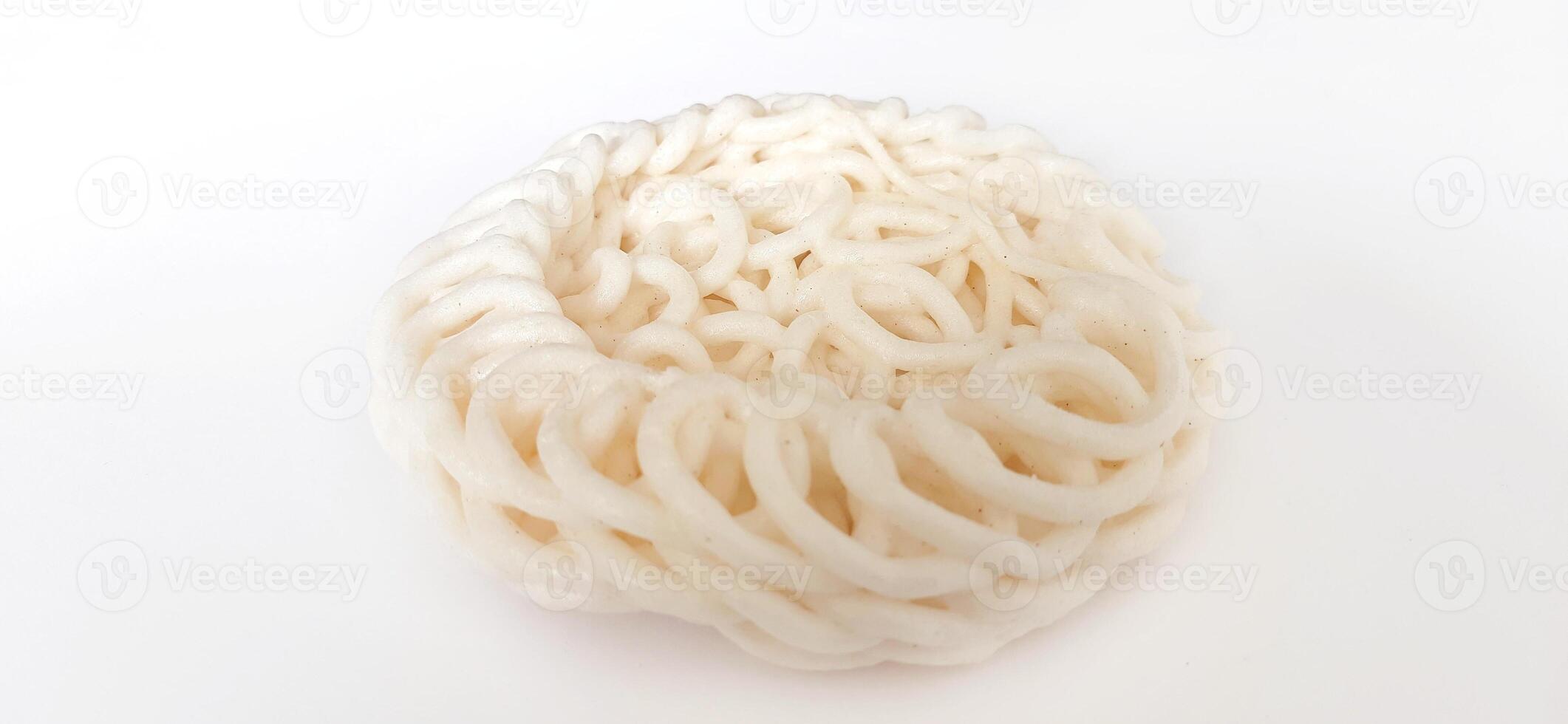 White noodle crackers or kerupuk putih or kerupuk warung made from tapioca flour, snack food from Indonesia isolated on white background photo