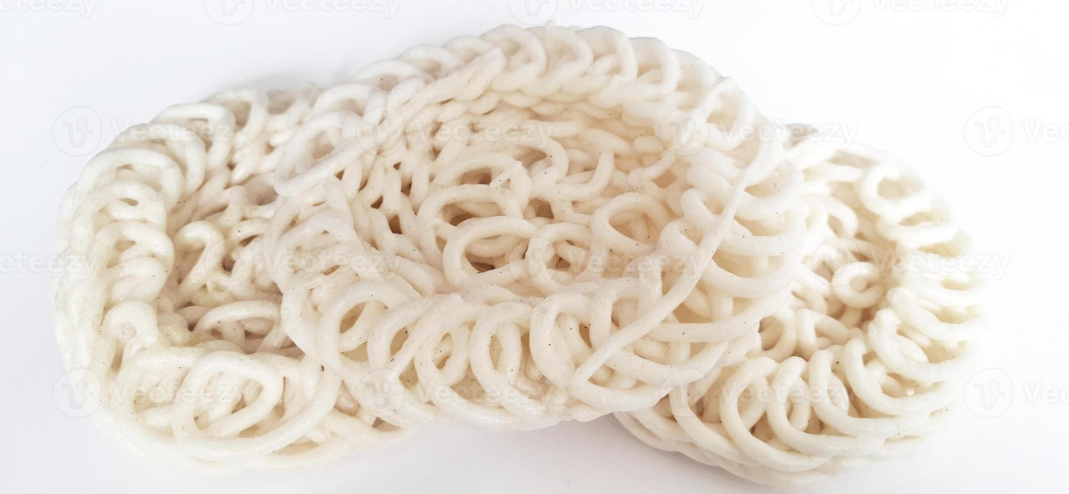 White noodle crackers or kerupuk putih or kerupuk warung made from tapioca flour, snack food from Indonesia isolated on white background photo