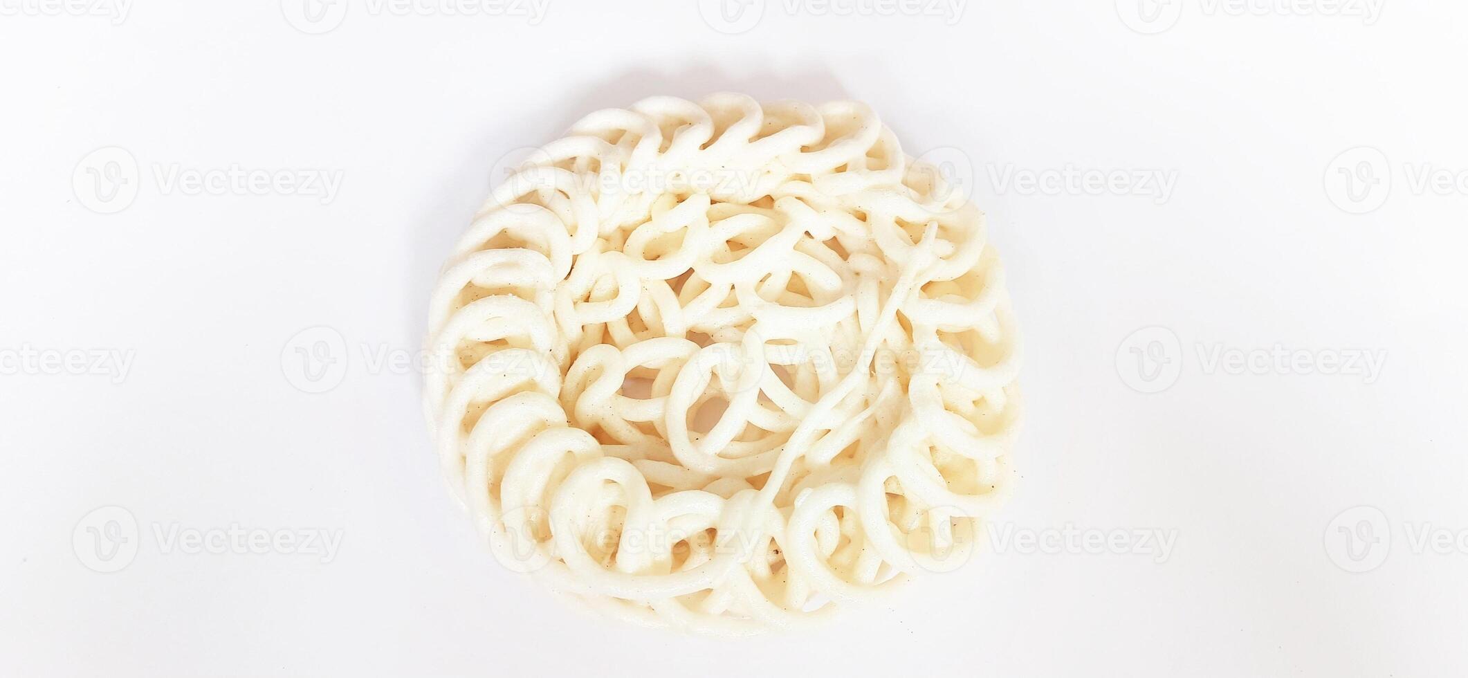 White noodle crackers or kerupuk putih or kerupuk warung made from tapioca flour, snack food from Indonesia isolated on white background photo