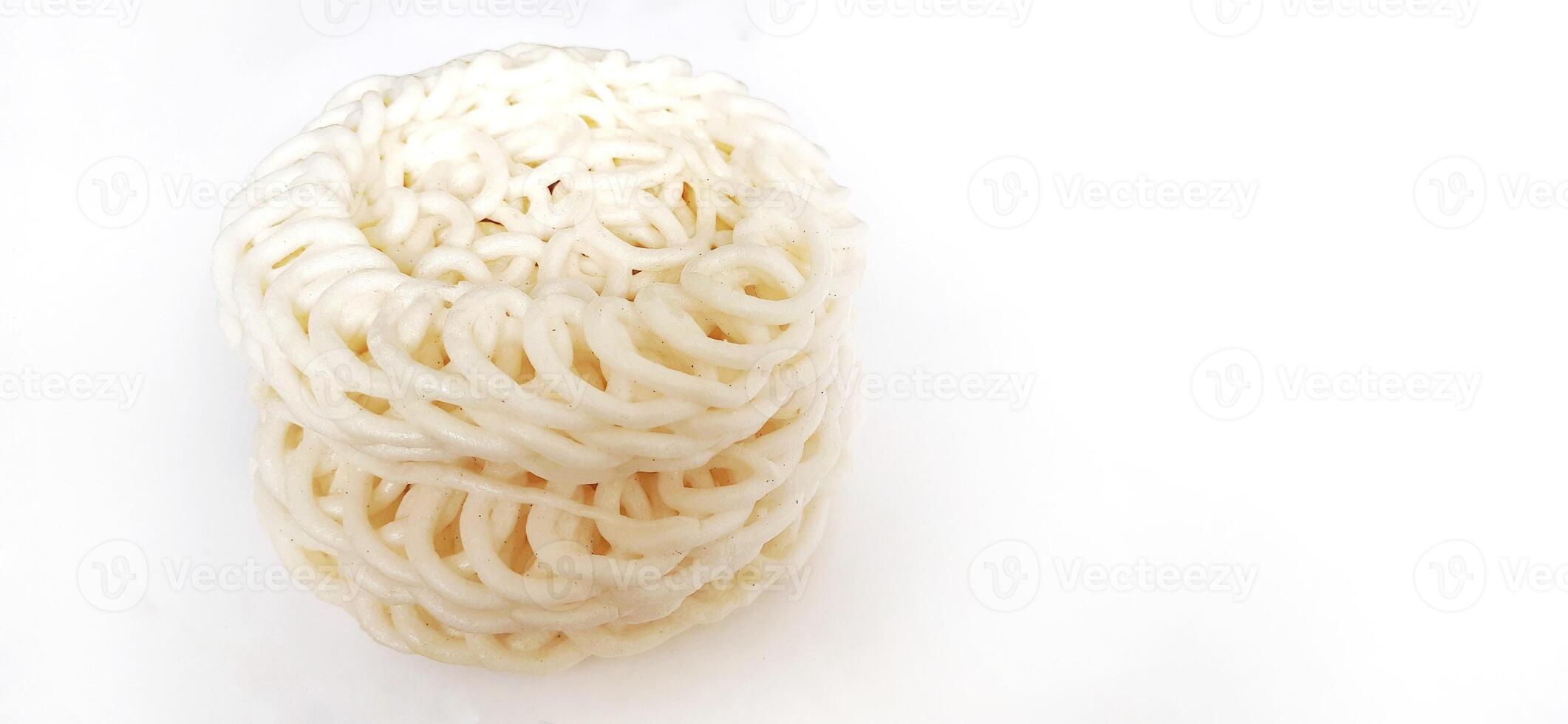 White noodle crackers or kerupuk putih or kerupuk warung made from tapioca flour, snack food from Indonesia isolated on white background photo