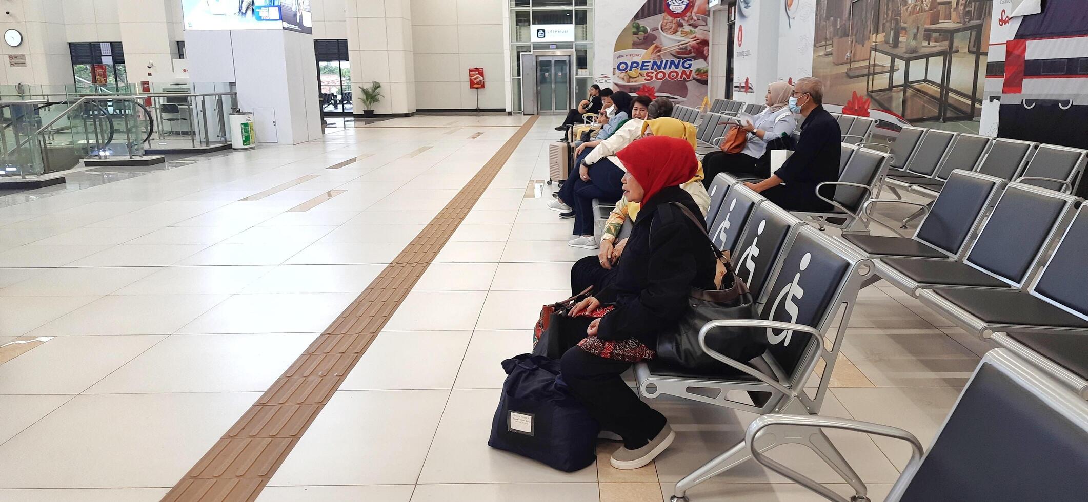 The atmosphere of KCIC Halim station, WHOOSH fast train, route Jakarta - Bandung. Modern passenger train moving fast on railway platform. Commercial transportation. Jakarta, Indonesia, October 28 2024 photo