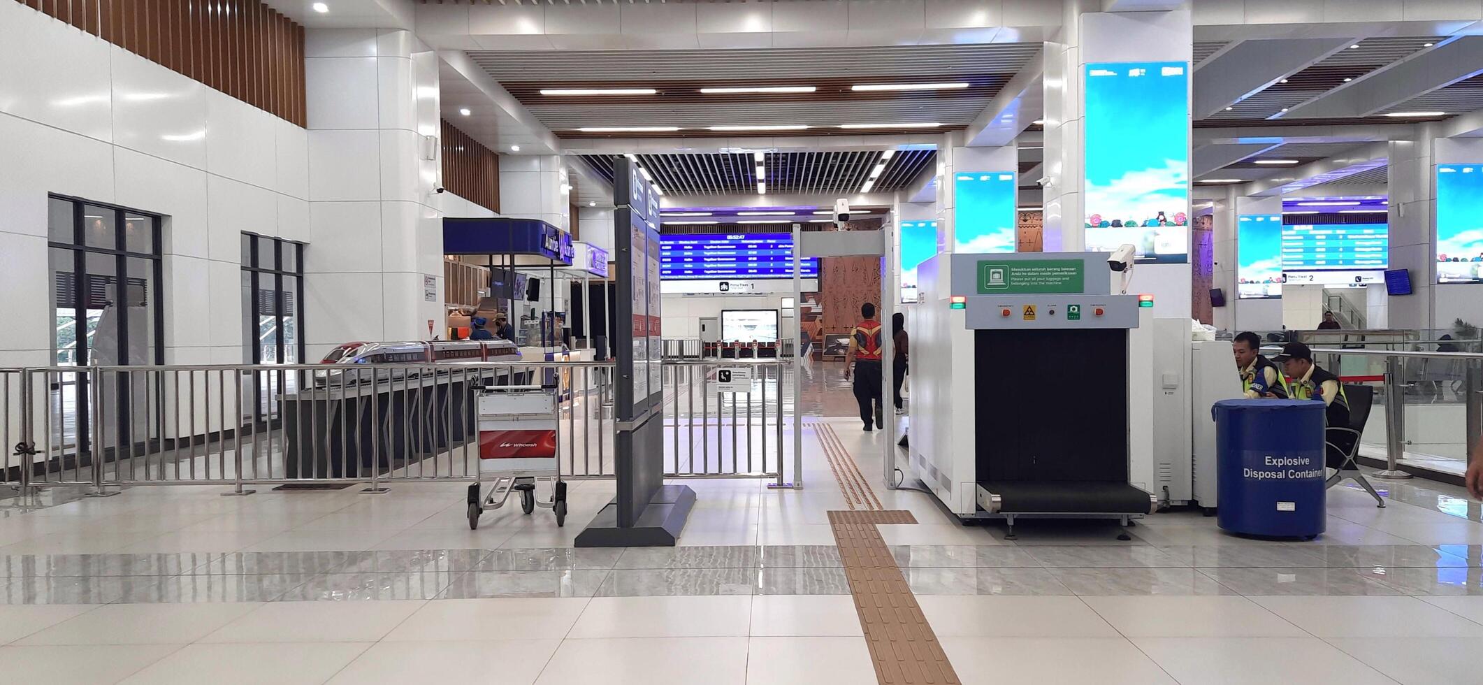 The atmosphere of KCIC Halim station, WHOOSH fast train, route Jakarta - Bandung. Modern passenger train moving fast on railway platform. Commercial transportation. Jakarta, Indonesia, October 28 2024 photo