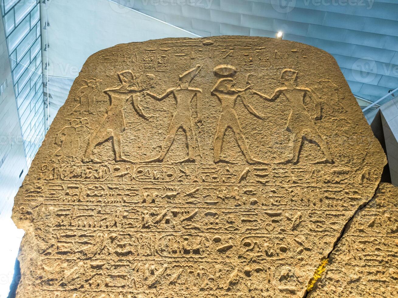 Old Egyptian hieroglyphs on an stone background. Ancient Egyptian hieroglyphs as pattern in Tombs. photo