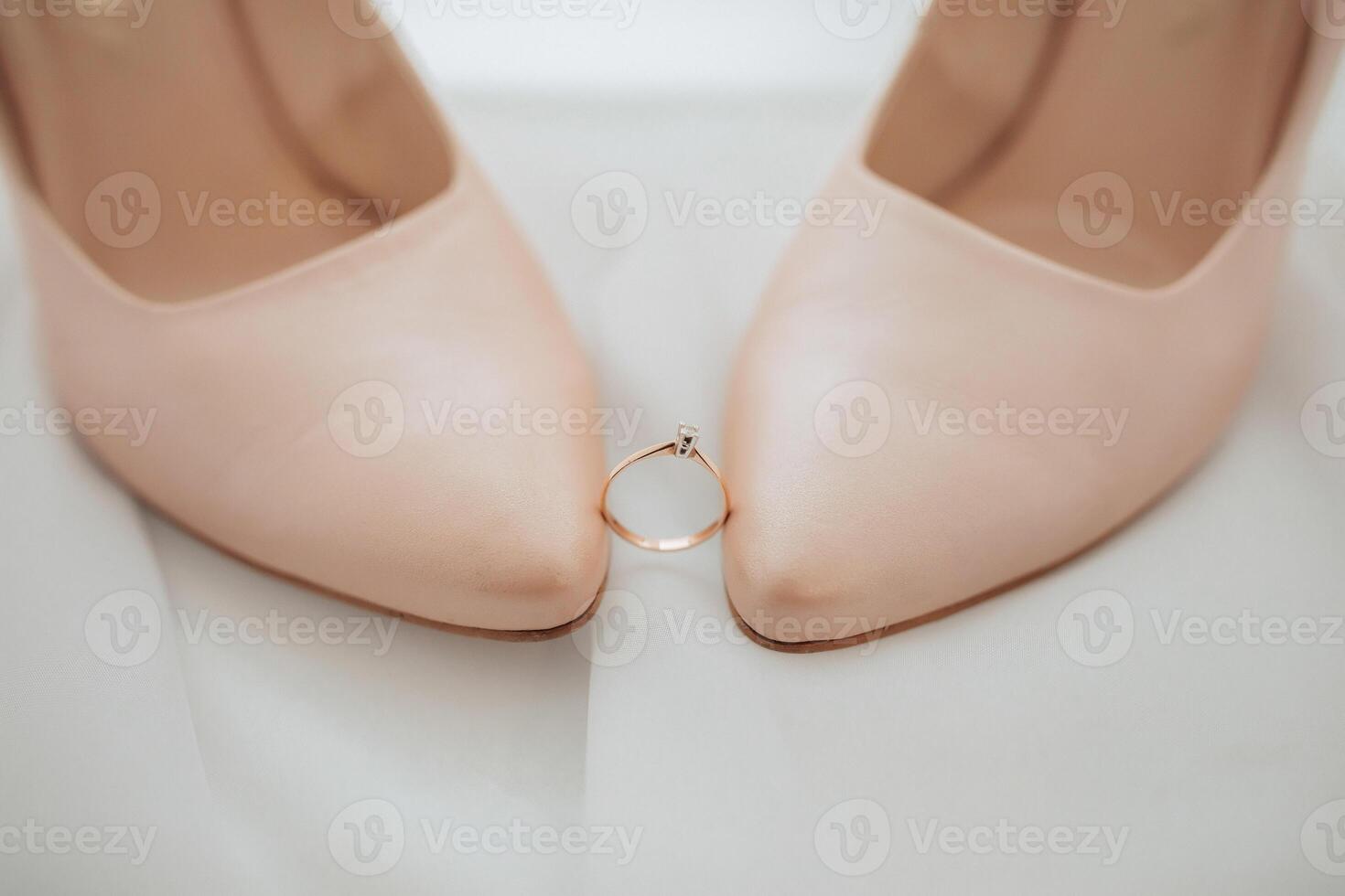 A pair of shoes with a ring on them photo
