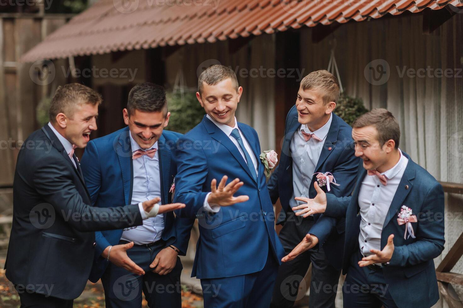 A group of men in suits are posing for a picture photo