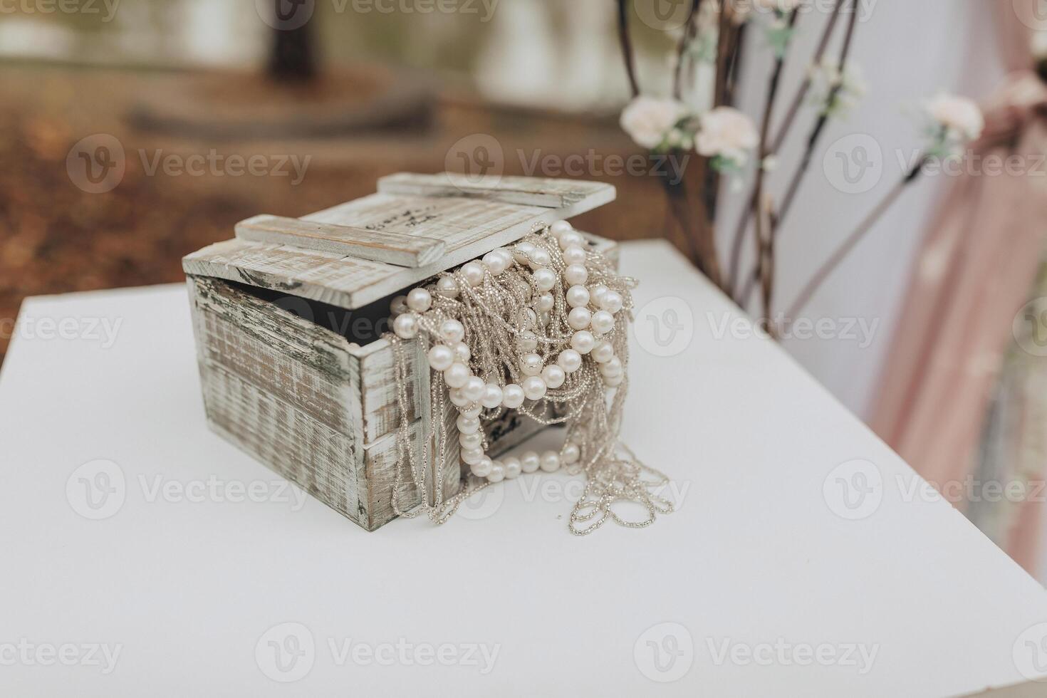 A wooden box with a white lid and a white background photo