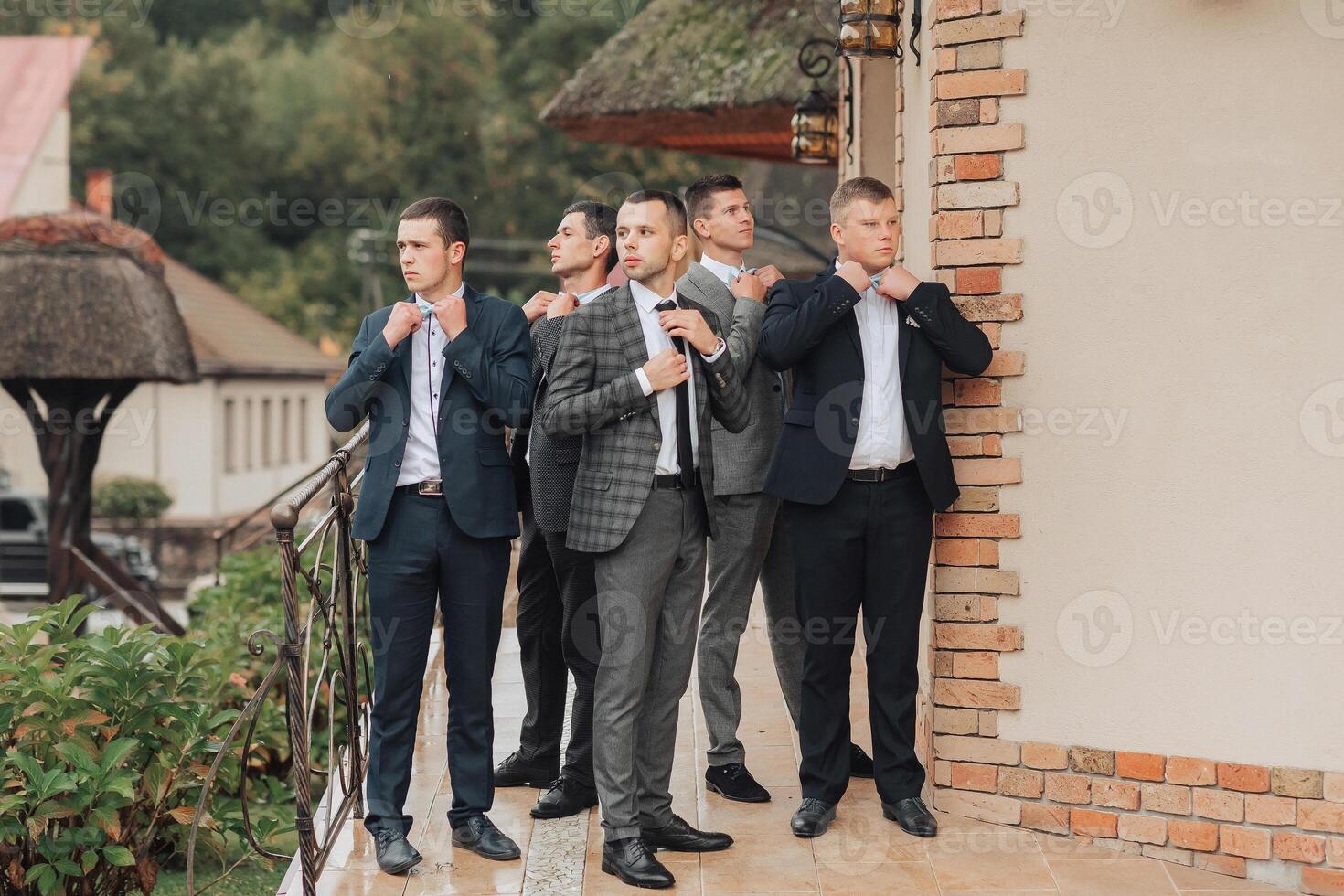 A group of men in suits are standing outside a building photo
