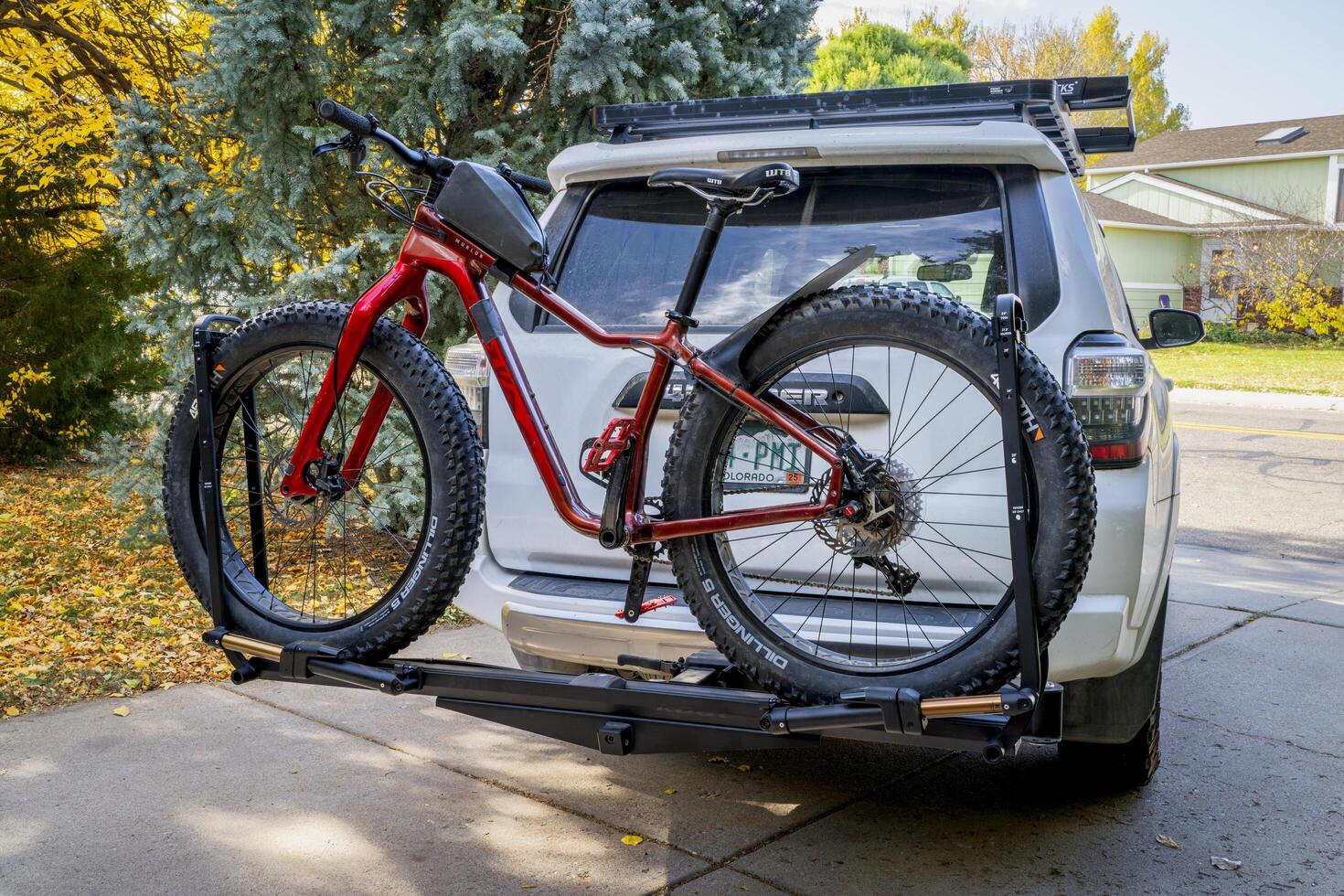 Fort Collins, CO, USA - October 25, 2024, Salsa Mukluk fat bike on the back of Toyota 4Runner SUV mounted with Kuat piston hitch rack. photo