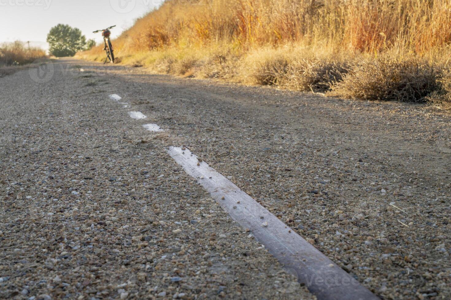 railroad tracks remains on Great Western Bike Trail, rails to trails conversion project in northeastern rural Colorado photo